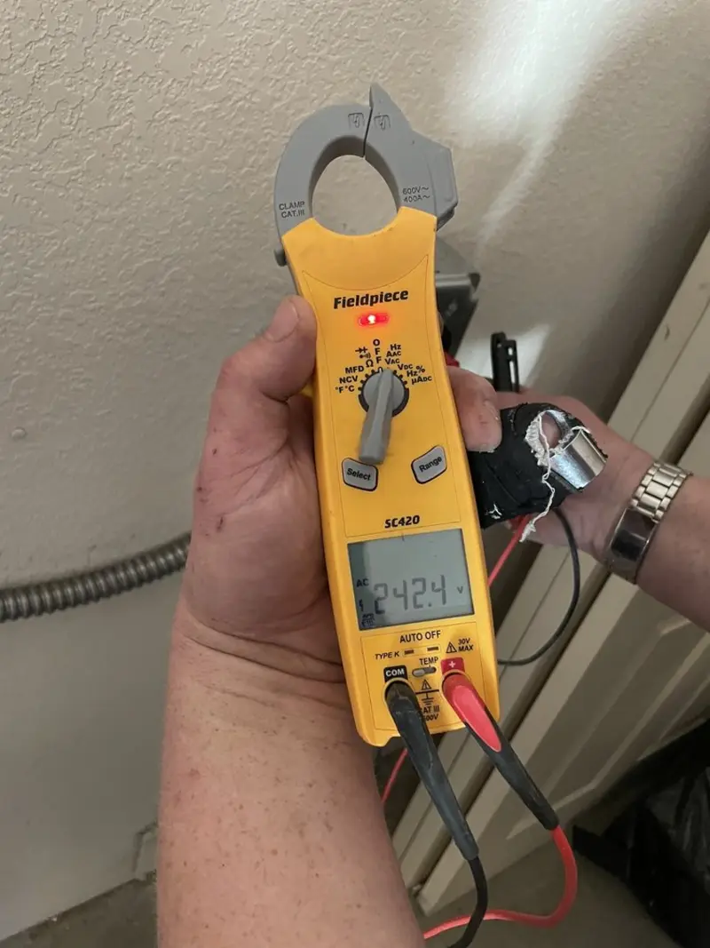 Voltage testing with clamp meter during Recessed Lighting Installation in Lafayette
